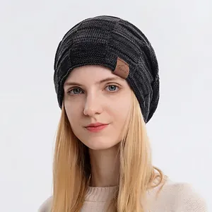 Winter chunky knit beanie in dark gray checkerboard pattern with sport leather patch
