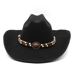 Detail of western wool felt hat featuring beaded decorative band with bronze relief buckle