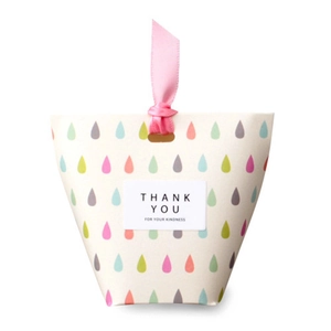 Creamy white gift box with colorful rain patterns, pink ribbon and Thank You label