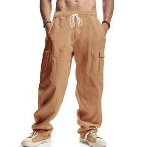 Detail of warm khaki cargo pants featuring elastic waist with contrast white drawstrings