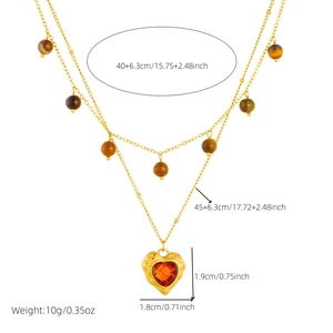 Double-layered gold chain necklace with tiger eye beads and red heart pendant