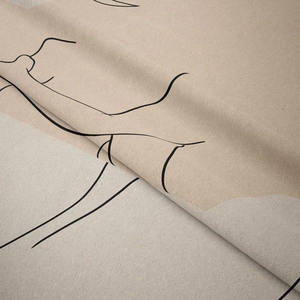 Detailed close-up of soft short-plush fabric with minimalist black line art and beige tones
