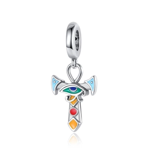 Macro shot of silver Ankh charm with Eye of Horus detail and colorful enamel inlay