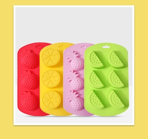 Detail view of colorful fruit-shaped silicone molds for ice cubes and baby food