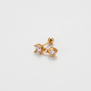 Macro shot of gold heart zircon helix earring with a screw ball back design