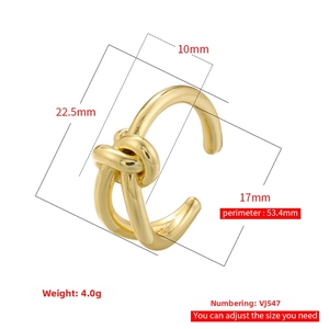 Detail view of gold knot ring with adjustable opening and mirror polished texture