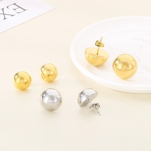 Minimalist 18K gold and silver hollow sphere stud earrings in a glossy metallic finish