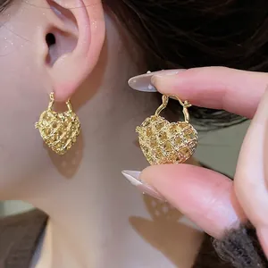 French vintage hollow metal heart hoop earrings with elegant woven texture for women