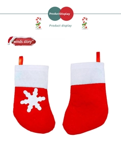 Detail of red and white Christmas stocking cutlery holders with snowflake pattern