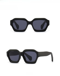 Front and side view of matte black irregular polygon sunglasses with dark grey lenses