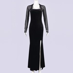 Detail of elegant black velvet dress with mesh sleeves and a high side slit feature