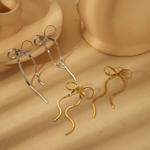 Elegant 18k gold plated stainless steel bow earrings with long wavy snake chain drops