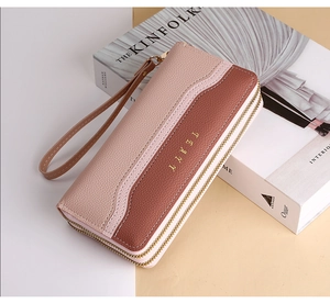 Detail of long double-zipper wallet featuring three-color lychee pattern faux leather