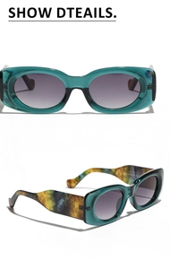Detail view of oval retro sunglasses with translucent teal frames and textured temples