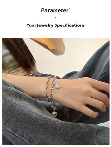 Detail of double-layer silver heart pendant bracelet with rectangular and round links