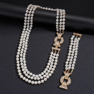 Elegant multi-layer pearl necklace and bracelet set with gold rhinestone geometric clasps