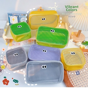 Close-up of colorful mesh storage bags with cute eyes for cosmetics and toiletries
