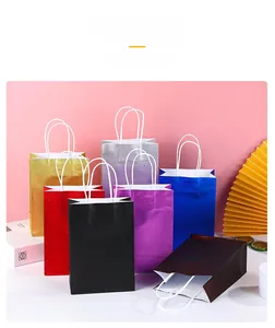Macro detail of glossy glitter texture on colorful paper gift bags with round handles