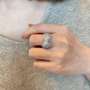 Elegant silver bow ring with micro-paved zircons in a crisscross design for women
