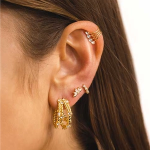 Detailed view of S925 silver golden tassel butterfly stud and layered cz ear cuff set