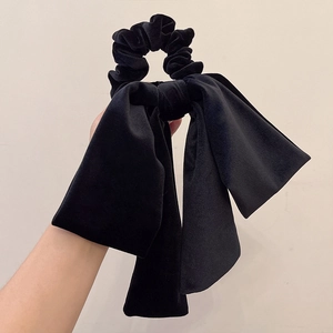 Elegant black velvet bow scrunchie with long ribbons for a vintage french hair style