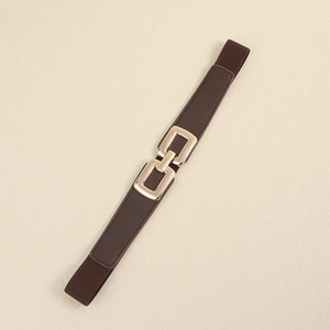 Detail of a brown elastic waist belt with an interlocking gold double-ring metal buckle