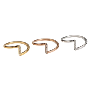 Three-piece set of thin wave-shaped stainless steel rings in gold, silver, and rose gold