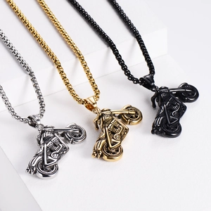 Three motorcycle pendant necklaces shown in silver, gold, and black finishes on white surface