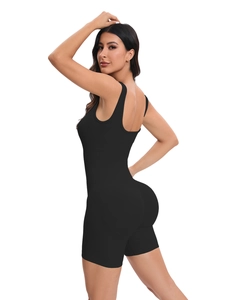 Close-up of seamless black ribbed bodysuit showing sculpting fabric and U-neck detail