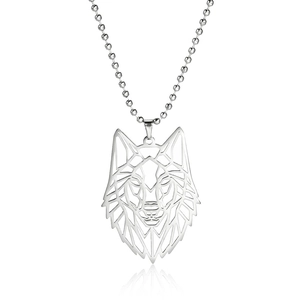 Detailed close-up of a silver geometric hollow wolf head pendant on a bead chain necklace
