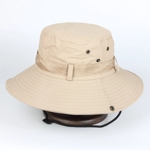 Detail of beige outdoor sun hat showing ventilation holes and reinforced brim stitching