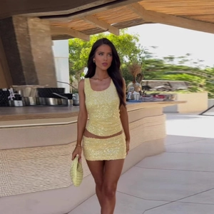 Chic yellow sequin two-piece set featuring a cropped tank top and mini skirt for parties
