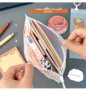 Wide opening of the translucent stationery bag showing large capacity for pens and notebooks