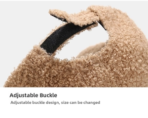 Detail of adjustable black strap and buckle on warm brown teddy fleece baseball cap
