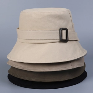 Vertical stack of stylish cotton bucket hats in beige, grey, khaki, and black colors