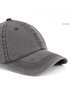 Detail of washed cotton texture and reinforced stitching on the vintage baseball cap brim