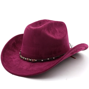 Detail of dark rose suede cowboy hat with braided leather band and ethnic beads