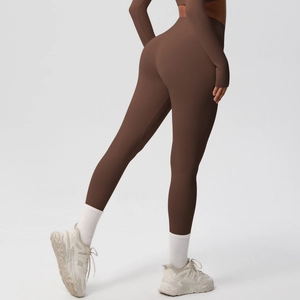 Detail view of coffee brown yoga set showing high-waist leggings and sculpted fit on model