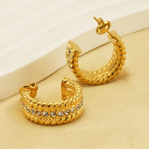 Chic twisted gold hoop earrings with sparkling rhinestones and rope texture