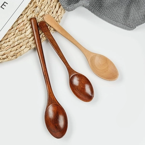 Three long-handled wooden spoons in natural and dark brown finish for coffee and desserts