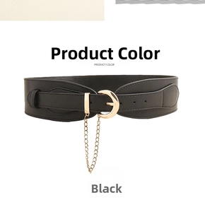 Detail of black wide belt with gold round buckle and decorative metal hanging chain