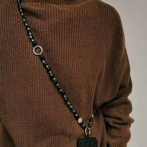 Ethnic style black beaded phone lanyard with silver hardware crossbody strap for women