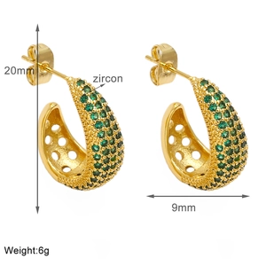 Detail view of 18k gold plated C-shape earrings with green zircon and 20mm dimensions