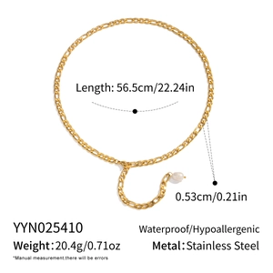 Detail view of gold Figaro chain necklace with pearl pendant and 56.5cm length measurements