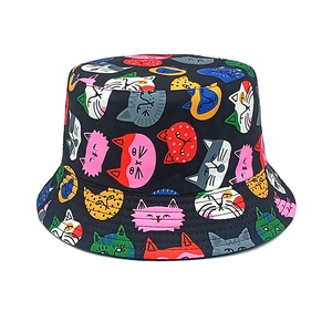 Detail view of the colorful cartoon cat print on this black reversible cotton sun hat