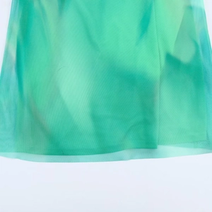 Elegant green mesh maxi dress featuring layered tulle fabric and a flowy hemline detail