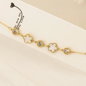 Elegant gold clover bracelet with white shell flower charms and round zircon accents