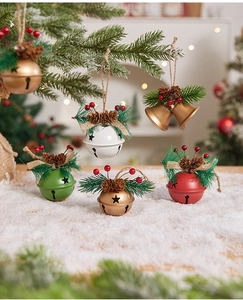 Detail of Christmas bell ornament with pine cones, red berries and star cut-outs