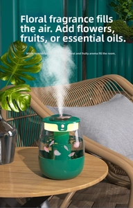 Macro view of green portable humidifier with internal flower petals and mist output