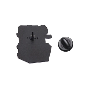Close-up of the black enamel pin back featuring a butterfly clutch and needle fastener